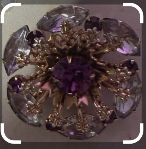 Vintage gold tone flower brooch with purple and clear rhinestones. Circa 1940's-1950's