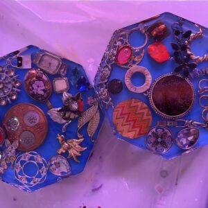 Blue coasters with vintage jewelry embedded