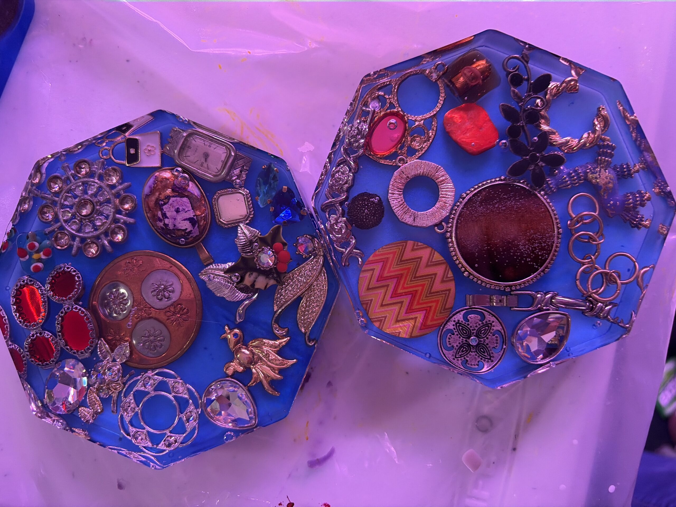 Blue coasters with vintage jewelry embedded